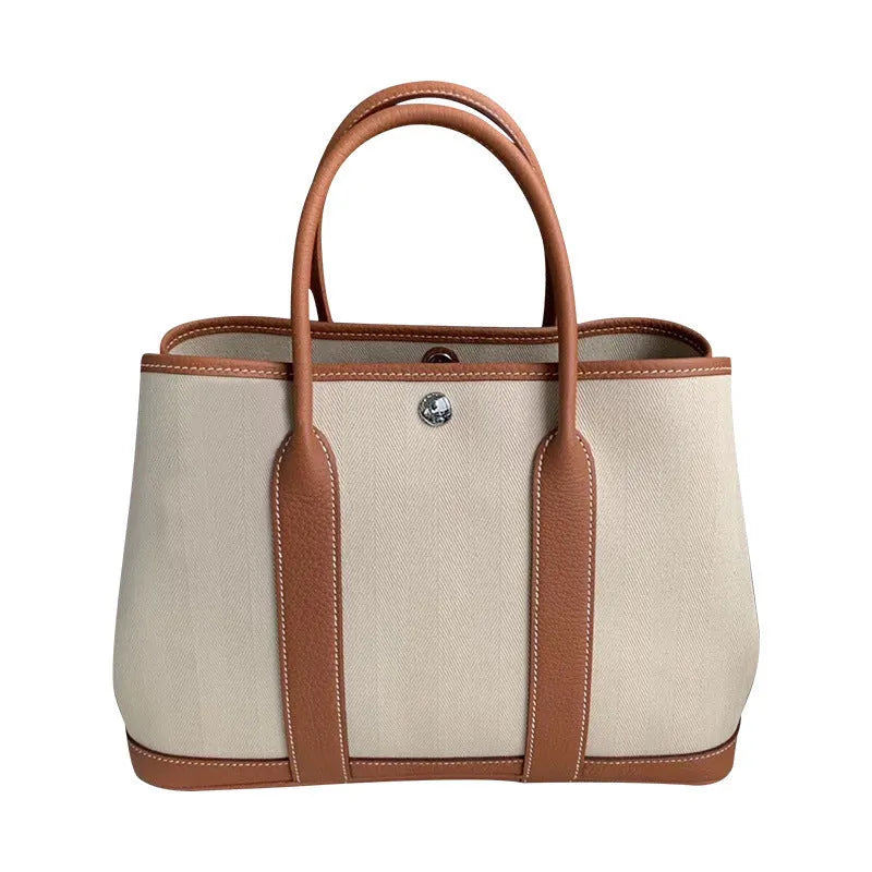 Genuine leather women's crossbody tote bag with canvas texture in bucket shape