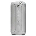 Outdoor waterproof portable speaker in black, camouflage, grey, or red colour with display showing Bluetooth, TF card, and AUX logos.