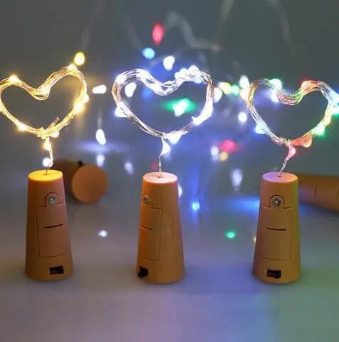 Copper wire LED string light with 20 bulbs and a white plastic bottle stopper for decoration.