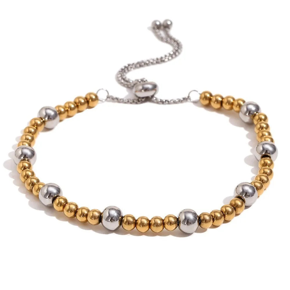Gold electroplated jewellery set with geometric circle earrings, matching necklace and bracelet