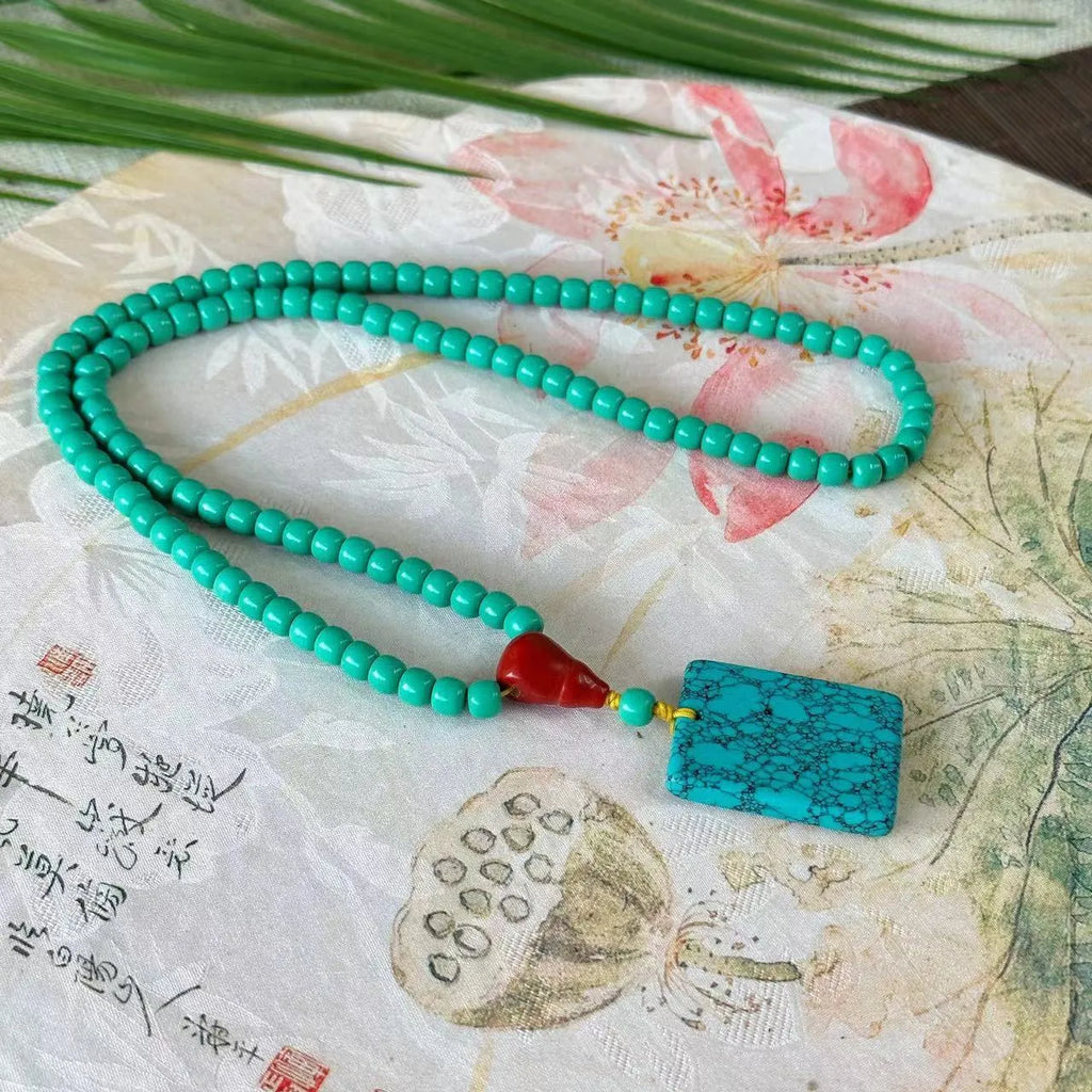 Hand-woven turquoise mesh flower lucky pendant necklace on ball bead chain