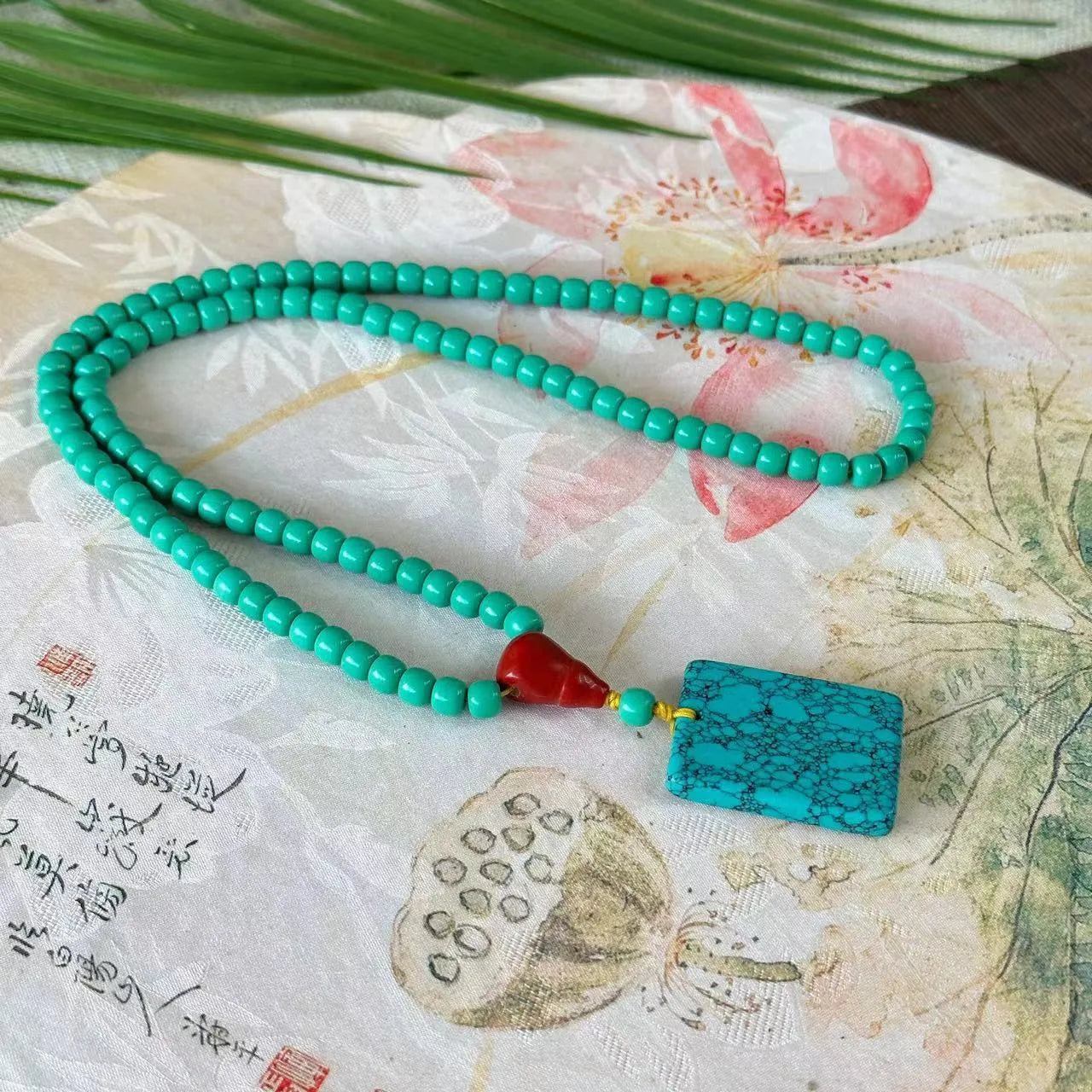 Hand-woven turquoise mesh flower lucky pendant necklace on ball bead chain
