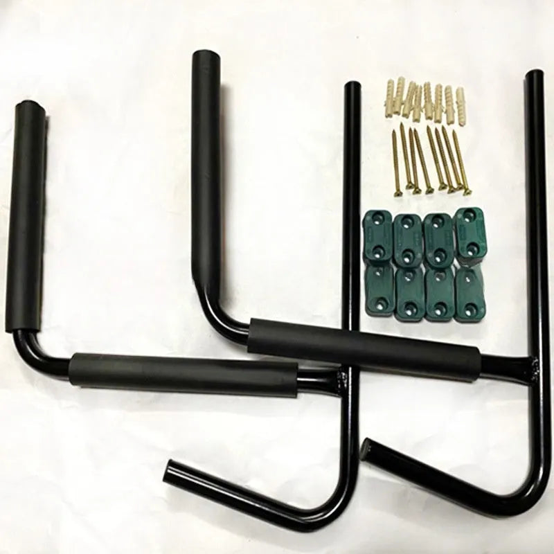 Carbon steel kayak and surfboard wall hanger rack mounted on a wall.