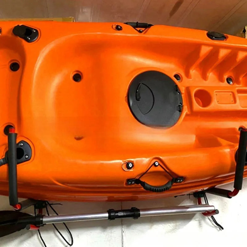 Carbon steel kayak and surfboard wall hanger rack mounted on a wall.