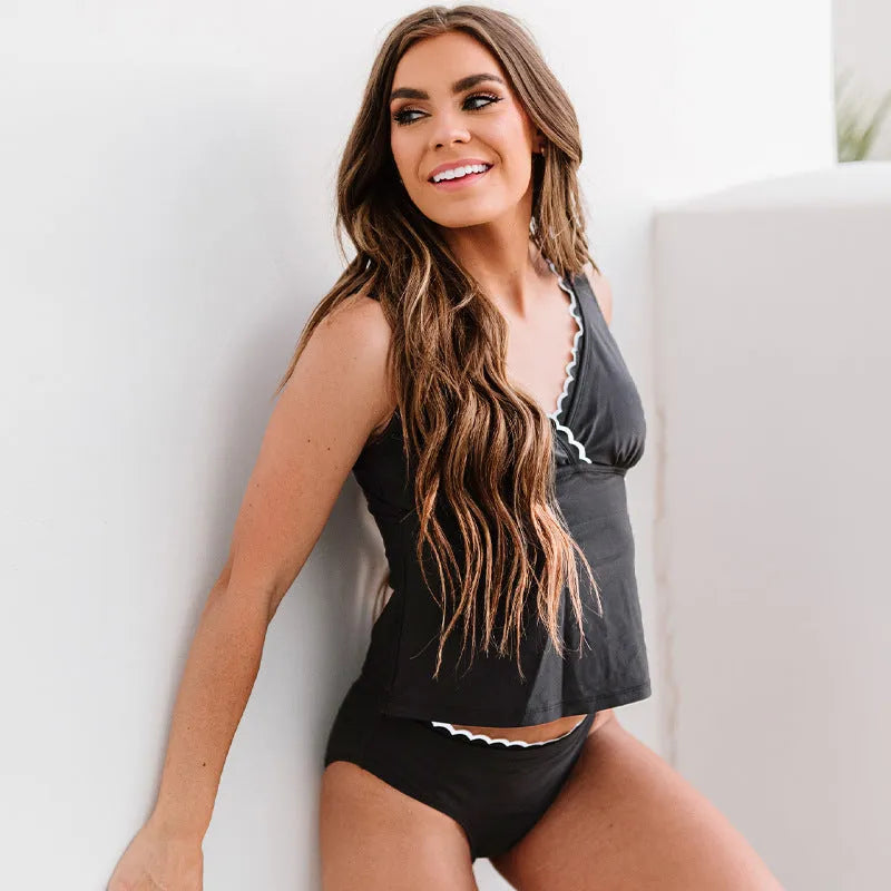 Black women's sleeveless split swimsuit or bikini on a mannequin
