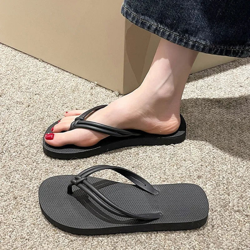 Women's PVC flip flops with toe-covering style and non-slip sole in multiple colours.
