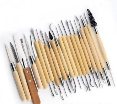 27-piece brown pottery clay tool set with wood, stainless steel and plastic tools rolled in a storage package.