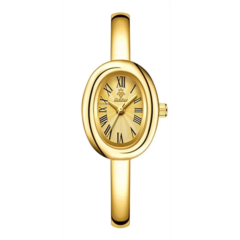 Women's slim oval retro quartz watch in gold colour on wrist