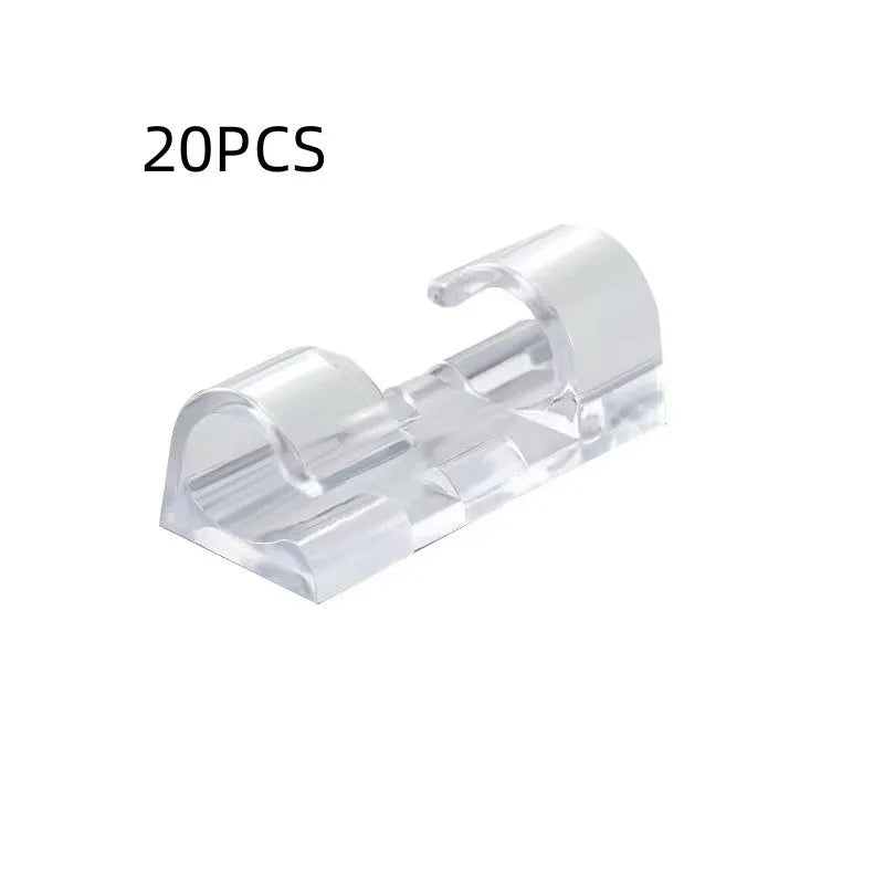 Transparent plastic self-adhesive wire routing clips for cable organisation