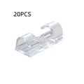 Transparent plastic self-adhesive wire routing clips for cable organisation