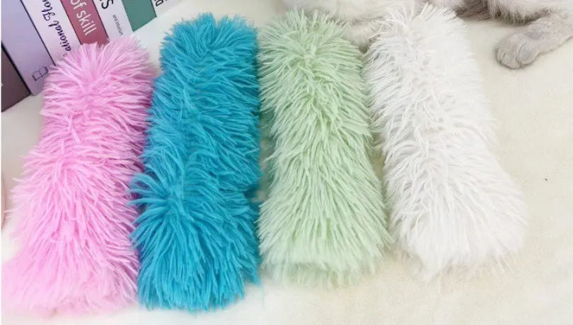Colourful cat plush toy pillow in blue, green, pink, or white, showing soft texture and 27cm length.