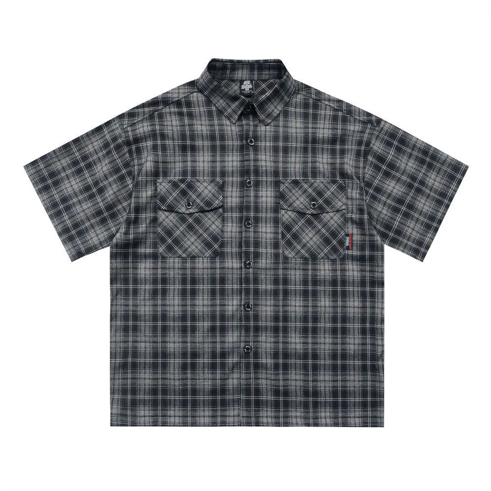 Men's black and brown plaid short sleeve shirt with embroidered letter design and lapel collar.