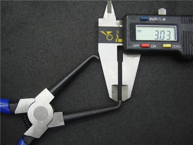 Iron and rubber caliper tubing pliers tool for automotive fuel line fittings in L and S sizes.