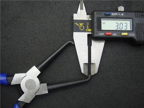 Iron and rubber caliper tubing pliers tool for automotive fuel line fittings in L and S sizes.