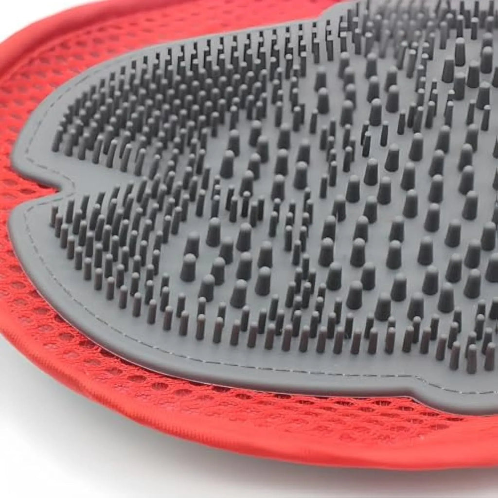 Red pet grooming glove combining a brush and mitt design for bathing dogs and cats.
