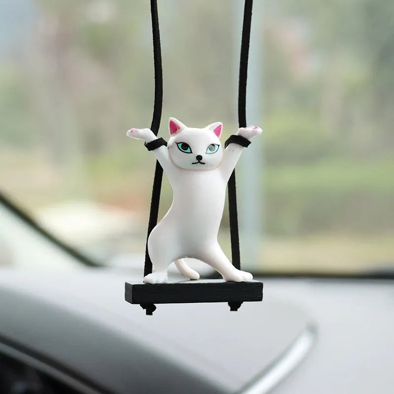 Resin cartoon cat pendant for car interior decoration on adjustable rope.