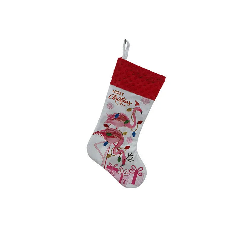Red cloth Christmas stocking with flamingo design, 46cm long, hanging on fireplace.
