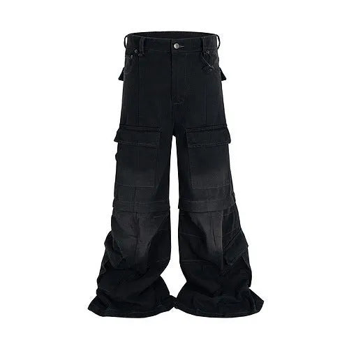 Black washed-out cotton overalls with multiple pockets and a detachable micro-pull design on a hanger.