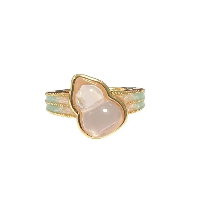 Adjustable Chinese gourd ring with zircon inlay showing floral and bow elements in oil-drip finish