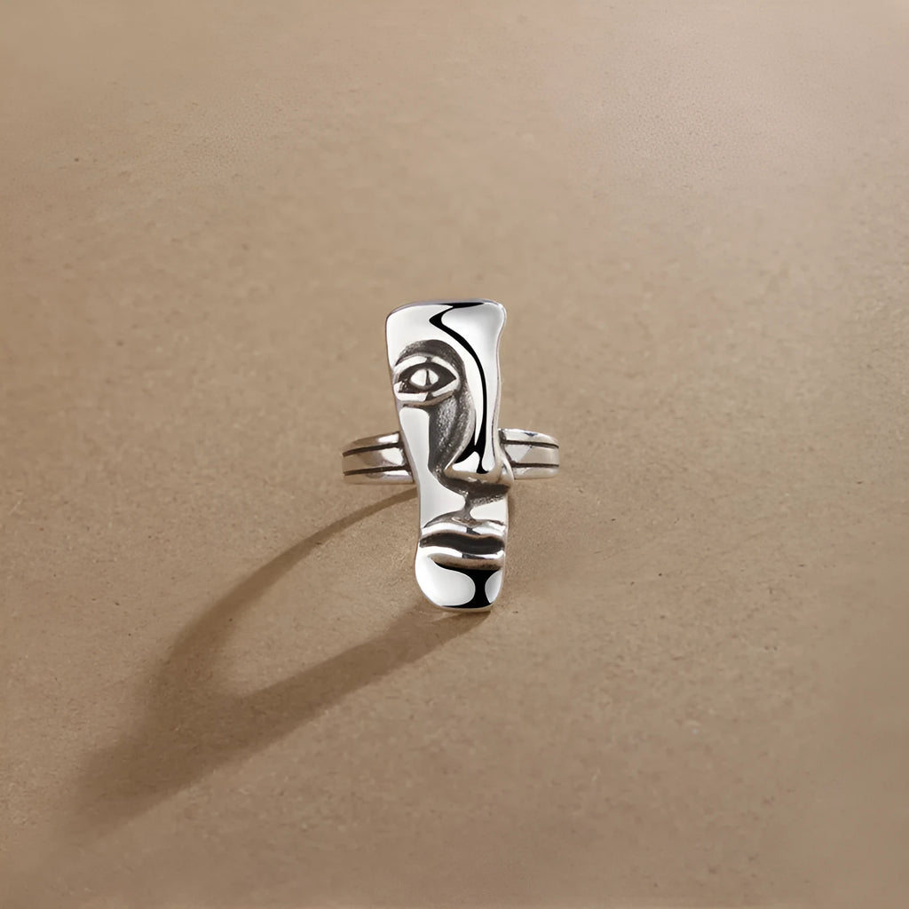 Copper retro half face mask ring with electroplated finish and adjustable opening on a neutral background.