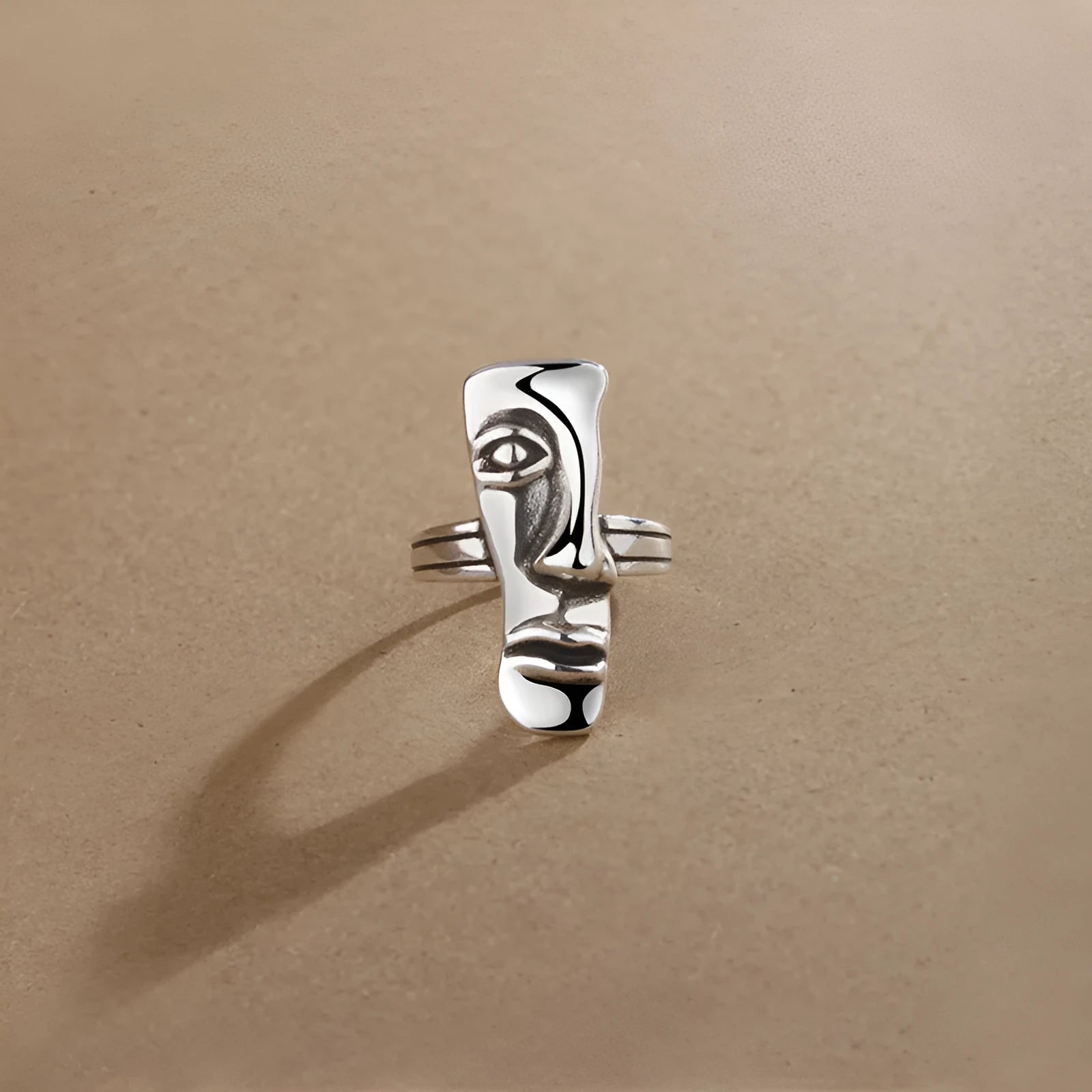 Copper retro half face mask ring with electroplated finish and adjustable opening on a neutral background.