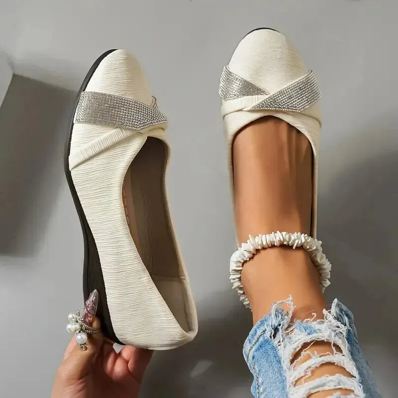 Black women's slip-on casual shoes with a chunky heel and rhinestone decoration on the fabric upper.
