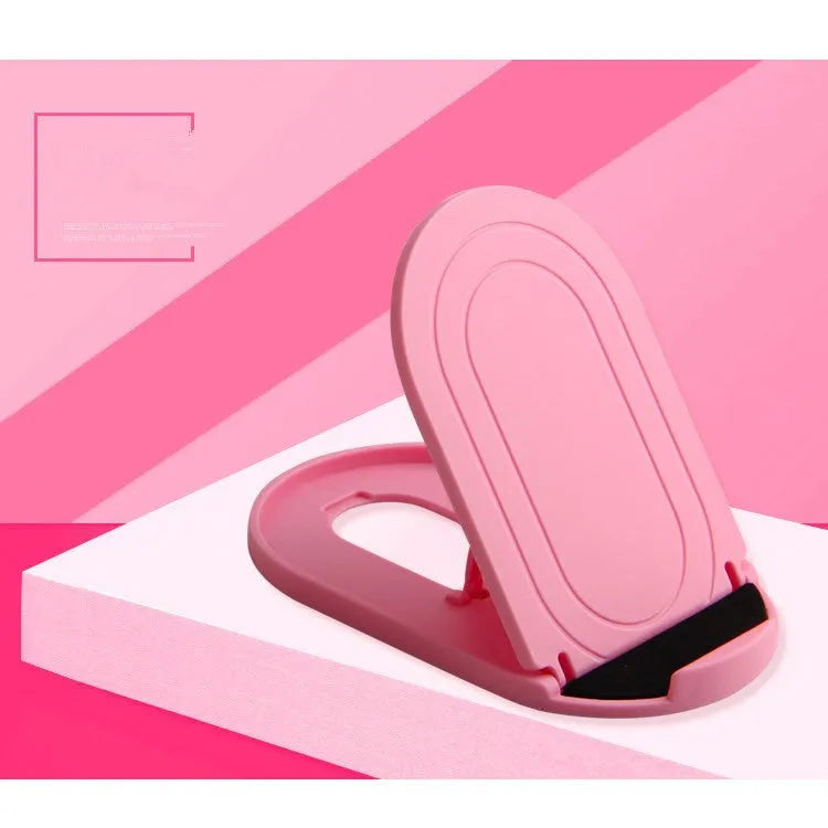 Plastic lazy bracket mobile phone stand in multiple colours on a desk