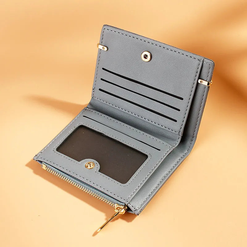 Ladies short zipper wallet in PU leather, open to show multiple card slots, bill holder, change slot, and hidden compartment.