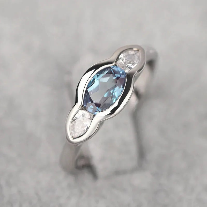 Women's geometric ellipse copper ring with white gold finish and inlaid zircon stones.