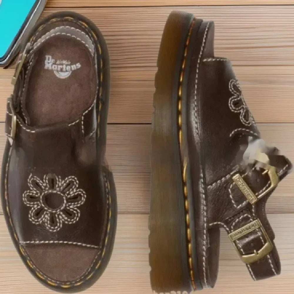 Men's black embroidered floral pattern beach sandals with flat heel on a white background.