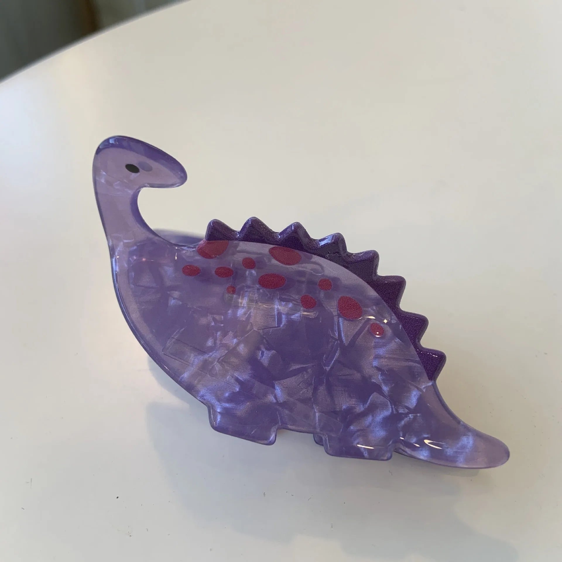 Acrylic dinosaur jaw clip hairpin in blue, brown, green, pink and purple colours with manual grip style