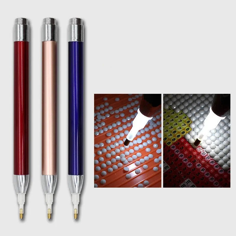 Aluminium alloy luminous drill pen for diamond painting in gold, red, or blue colour.