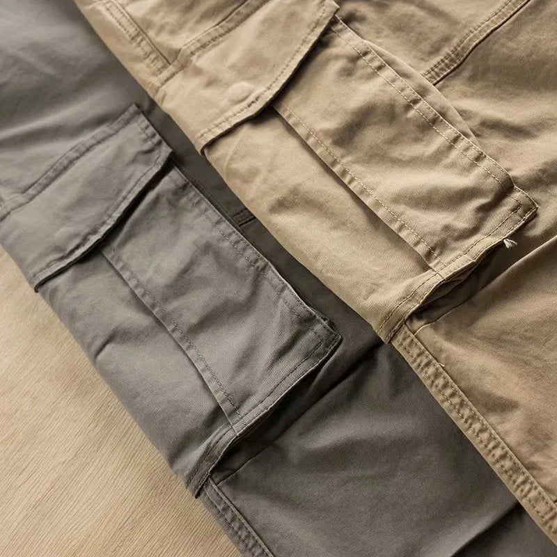 Men's solid colour cotton multi-pocket labour protection trousers in a cropped length.