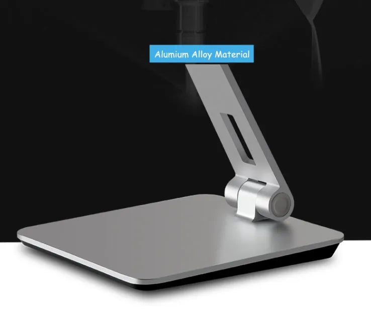 Silver aluminium and ABS folding stand holding a tablet, showing 360-degree rotation and anti-slip silicone pads.