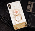 Luxury diamond and gold iPhone ring stand holding iPhone in rose gold finish