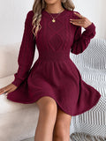 Women's black lantern sleeve sweater dress with a twisted elastic waistband.