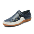 Women's plus size blue flat sandals with a hollow-out toe cap and thick rubber sole.