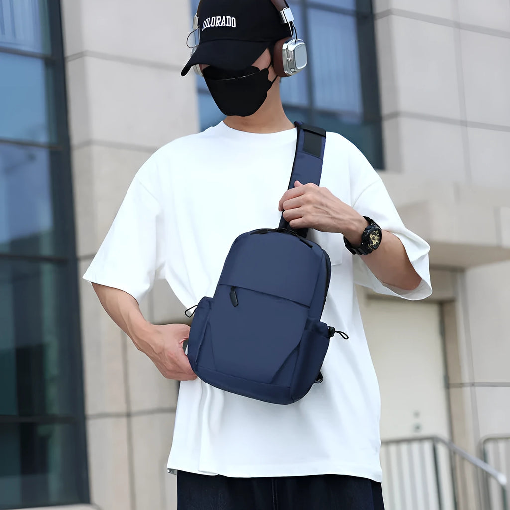Men's grey lightweight messenger chest bag showing front view and open large main compartment