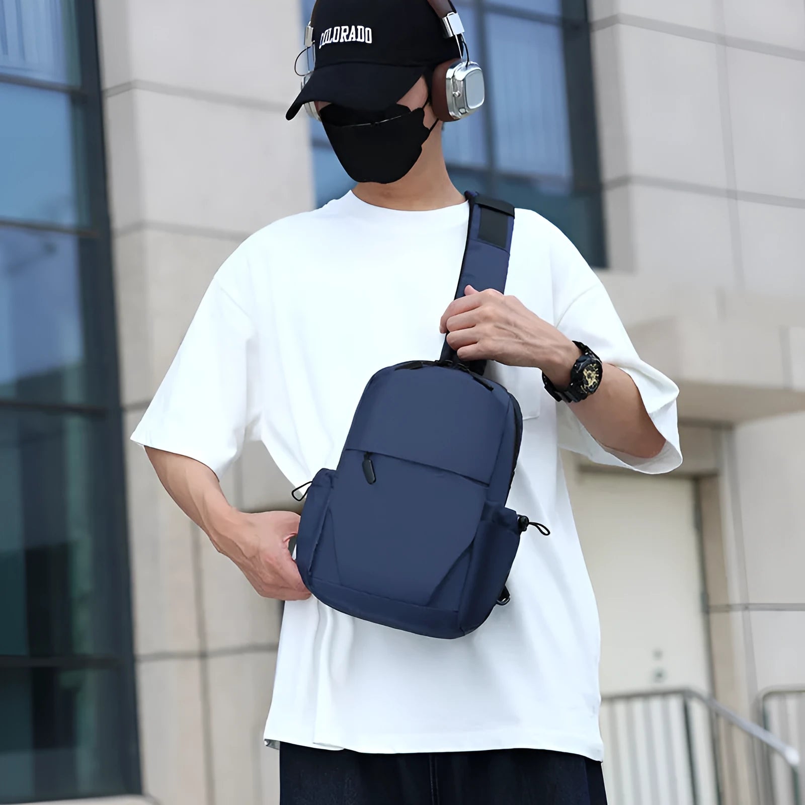 Men's grey lightweight messenger chest bag showing front view and open large main compartment