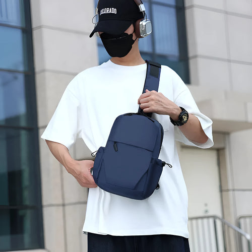 Men's grey lightweight messenger chest bag showing front view and open large main compartment