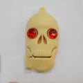Halloween-themed skeleton skull USB flash drive with small chain in assorted colours.