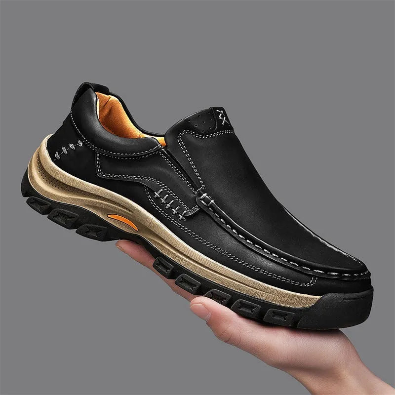 Men's black mountaineering shoes with thick rubber soles and round toe design for outdoor hiking