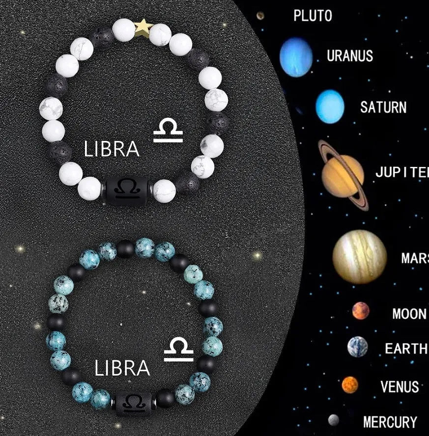 Two natural stone beaded zodiac bracelets with adjustable strings on wooden surface