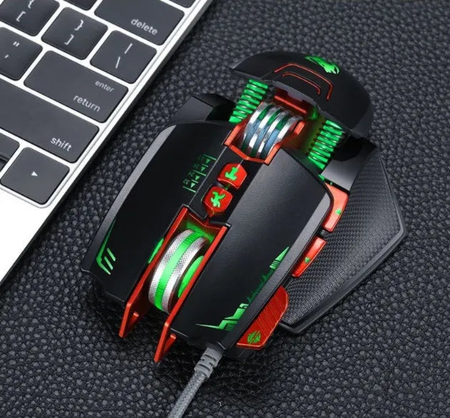 Black Thunder Wolf V9 wired gaming mouse on a desk, showing its ergonomic shape and USB cable.