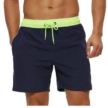 Men's blue fitness shorts with stitched waist headband, drawstring, zipper pocket, and padding for running