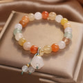 Natural Jinsi Jade round bead beaded bracelet with lily pendant on neutral background