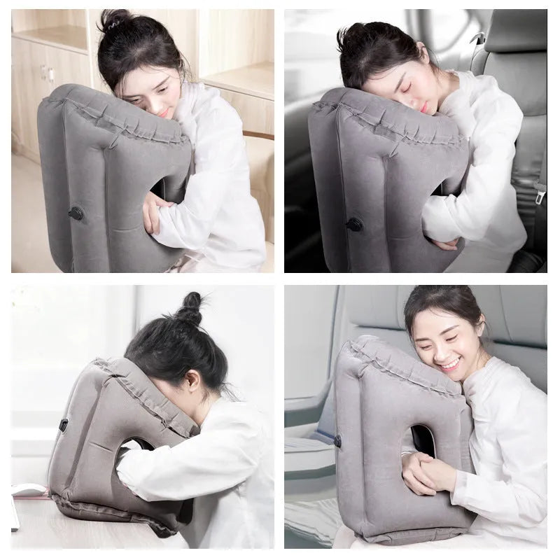 Grey inflatable sleeping pillow with flocking surface deflated on surface with storage bag