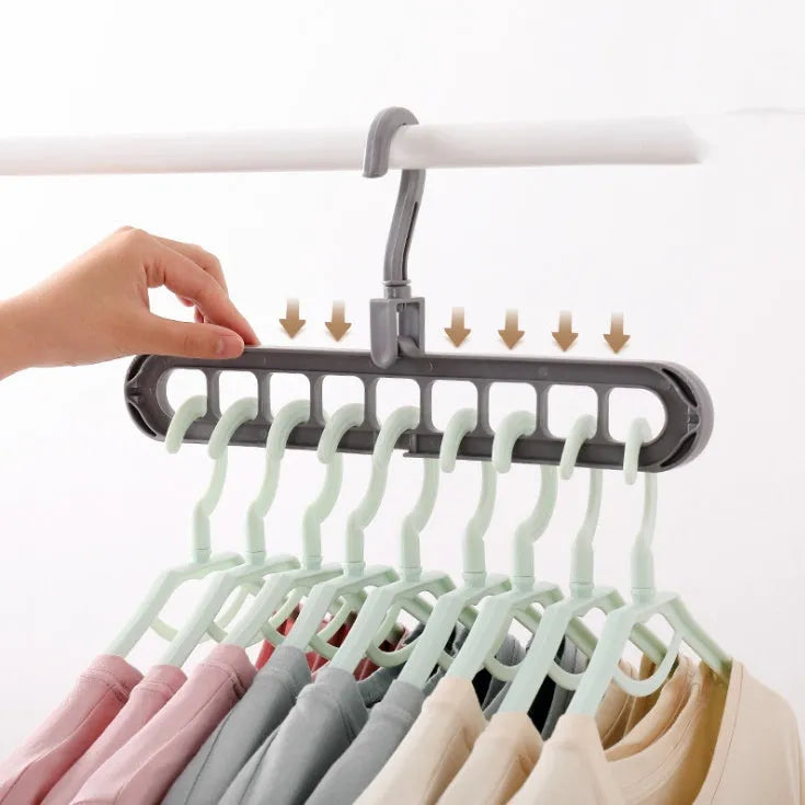 Plastic clothes hanger with rotating hook in pink colour, showing 33cm length dimension