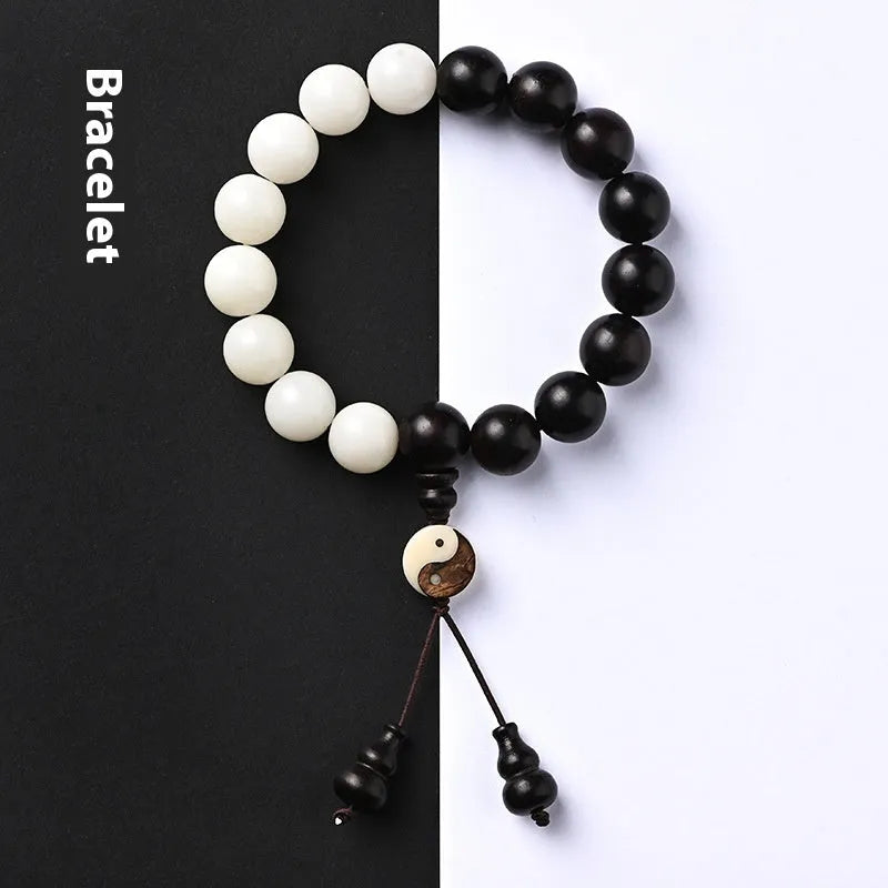 Handcrafted Bodhi seed bracelet with white Corypha Umbraculifera and Blackwood beads in eight-diagram pattern