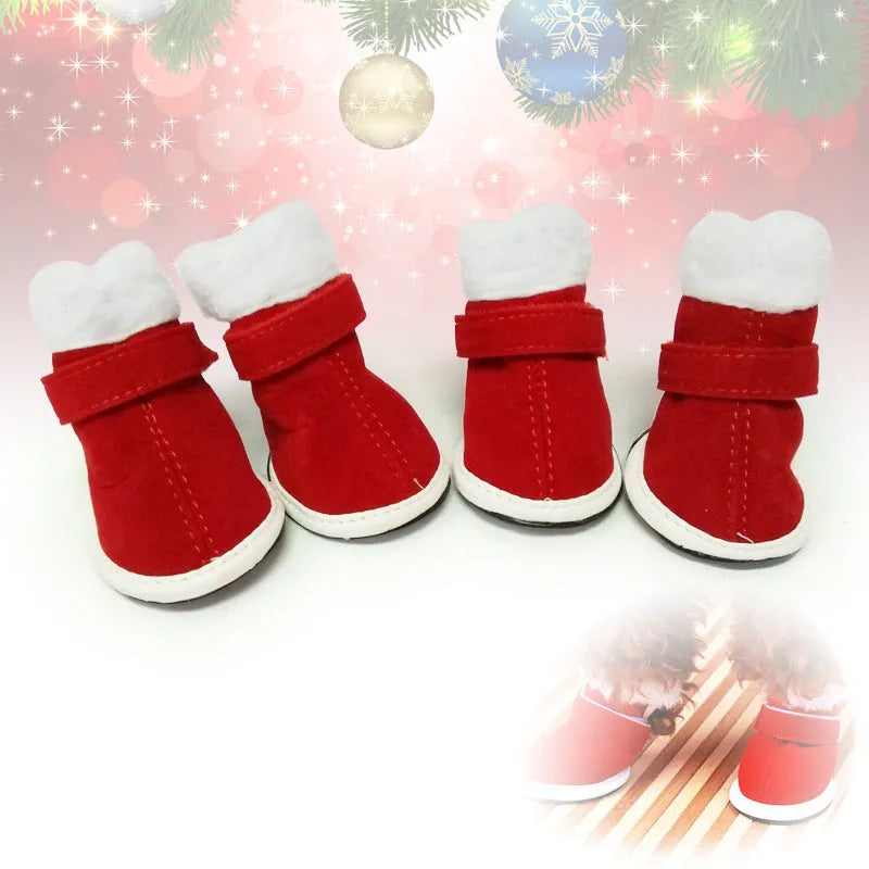 Red pet warm plush Christmas shoes with non-slip rubber sole for small dogs on a festive background